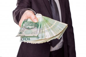 39105567 - polish money - pln - held by businessman 39105567 - polish money - pln - held by businessman